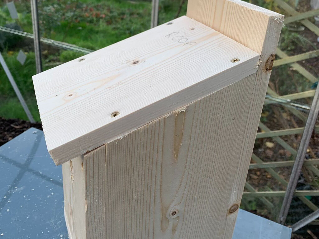 Outside image of the bird box with roof.